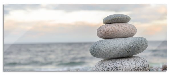 Steinturm am Strand, Glasbild Panorama Angebot